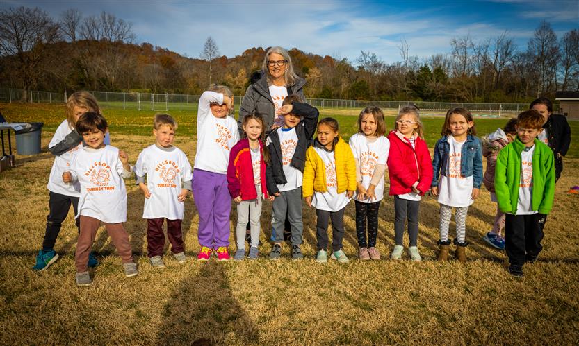 Students outside smile